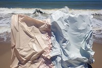 Abstract iridescent beach ripped paper marble effect outdoors nature ocean.