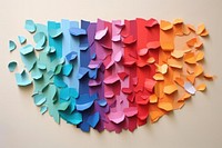 Abstract random rainbow flowers ripped paper art origami arrangement.