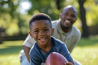 African American boy football sports child.