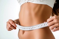 Woman using white soft tape measure undergarment bodybuilding underpants.
