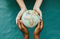 3 people hands holding a paper craft Globe globe planet green.