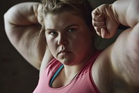 Fat white woman flexing muscle sports flexing muscles determination.