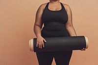 Fat woman holds an exercise mat sports adult black.