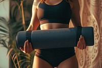 Fat woman holds an exercise mat sports determination bodybuilding.