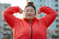 Fat asian woman flexing muscle sports adult flexing muscles.