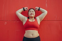 Fat asian woman flexing muscle pose sports adult flexing muscles.