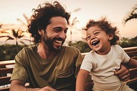 Brazilian dad spend time with son laughing family happy.