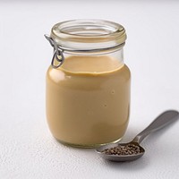 Mustard sauce in jar spoon drink food.