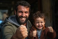 Brazilian father and son smile laughing family.