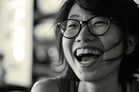 Woman Singaporean Joyful laughing portrait glasses.