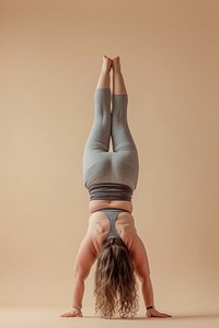 Chubby woman doing headstand yoga sports adult concentration.
