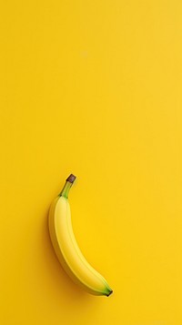  A big banana has fall to in street yellow fruit plant. AI generated Image by rawpixel.