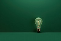  Sage green background with a shining light bulb border lightbulb electricity illuminated. AI generated Image by rawpixel.