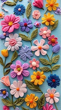 Wallpaper of felt wildflowers backgrounds embroidery pattern.