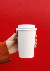 Coffee cup  holding drink hand.