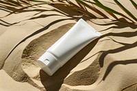 Tube skincare packaging  sand cosmetics sunscreen.