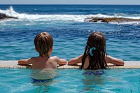 2 kids in icebergs pool swimming outdoors swimwear.