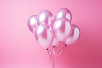 Photo of a foil balloons pink anniversary celebration.