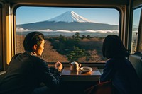 Asian couple with hot coffee mountain nature window.