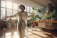 Black woman dances in the living room adult architecture accessories.