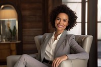 Business woman sitting and holding tablet smiling adult smile.