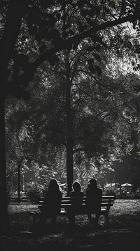 Photography of group of people at park outdoors sitting bench.