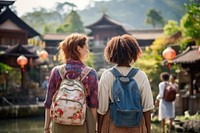 Mixed race friends travel japan cheerful backpack adult.