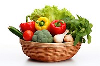 Vegetables in the small basket plant food white background.