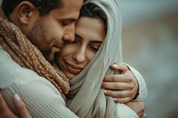 Middle eastern couple hugging together love affectionate togetherness.