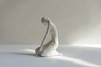 A sculpture woman white art representation.