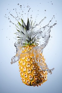 Pineapple floating with splash fruit plant food.