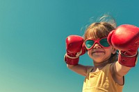 Superhero girl smiling sports boxing.