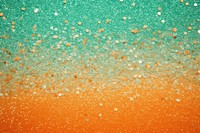 Green and orange glitter backgrounds outdoors.