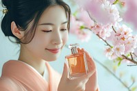 Japanese women perfume cosmetics holding.