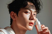 Korean man cosmetics headshot portrait.