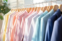 Suit rack clothesline consumerism arrangement. AI generated Image by rawpixel.