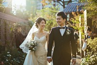 A young East Asian couple wedding dress fashion bride.