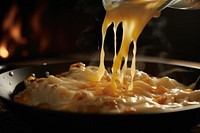 Italian chef precisely melting cheese dish food meal.