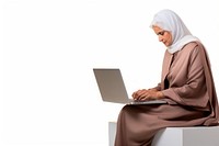 Mature Qatari woman watching tutorials computer sitting laptop.