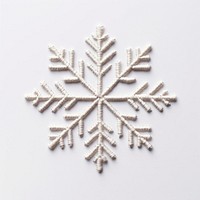 Snowflake in embroidery style pattern white celebration.