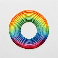 Rainbow in embroidery style pattern spiral paper.