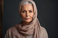 Middle East senior woman portrait hijab scarf.