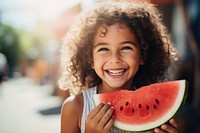 Middle eastern girl eating watermelon smiling summer smile.