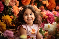 Qatari little girl having a photoshoot in a flower gardern portrait smiling smile.