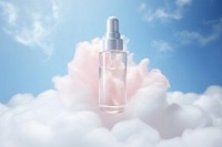 Serum on fluffy cloud cosmetics perfume bottle.