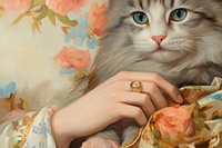 Women hand holding a cat painting ring portrait.