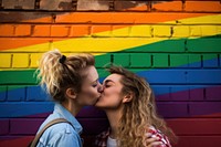 Teenage woman couple kissing wall architecture portrait. AI generated Image by rawpixel.