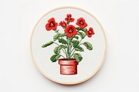 Potted plant in embroidery style needlework pattern flower.