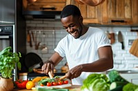 Black man cooking healthy food person adult home. 