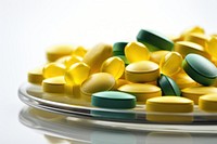 Tablet medicine yellow green pill. AI generated Image by rawpixel.